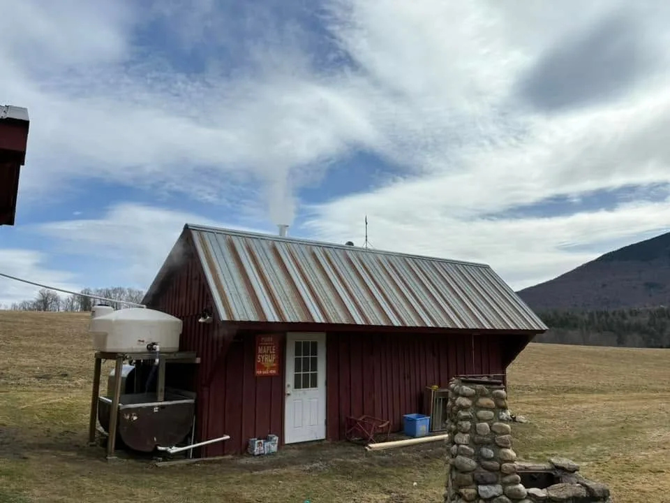 The red sugarhouse under a Vermont sky