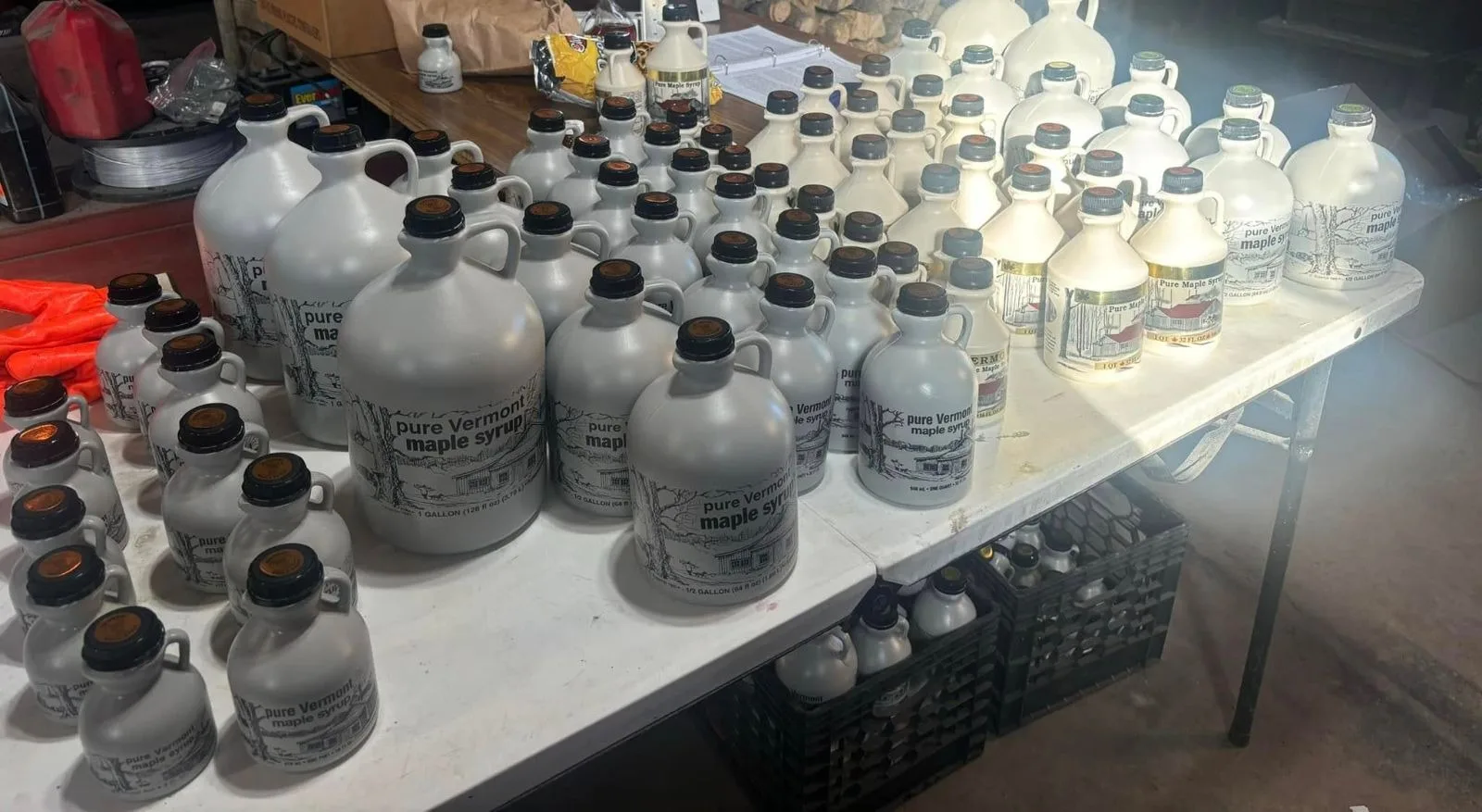 Rows of pure Vermont maple syrup jugs in every size